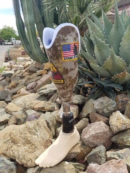 Prosthetic leg with a camouflage pattern outdoors